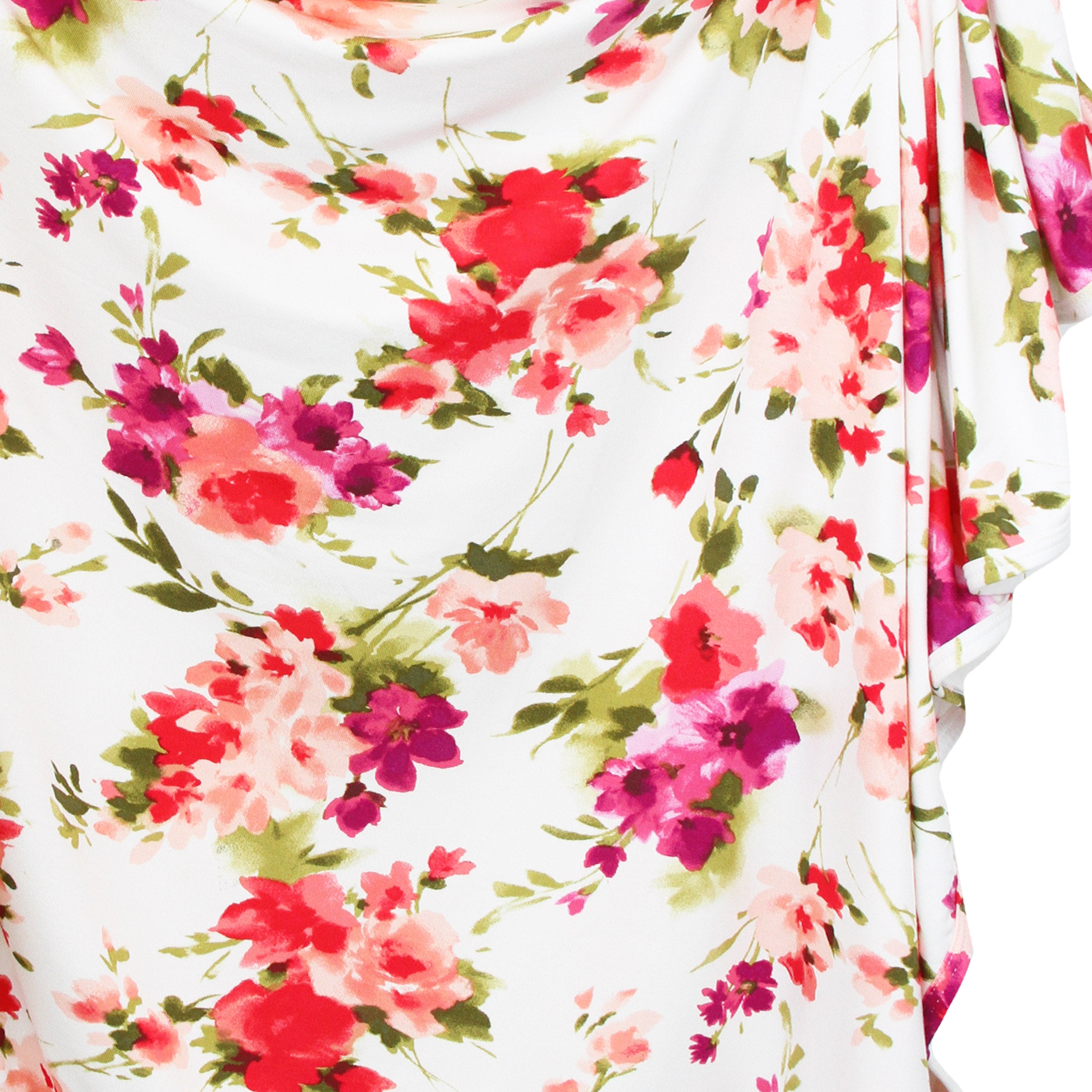 Floral fabric with pink, red, and purple flowers on a white background