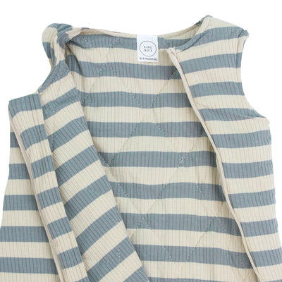 Striped baby outfit with blue and white stripes on a white background