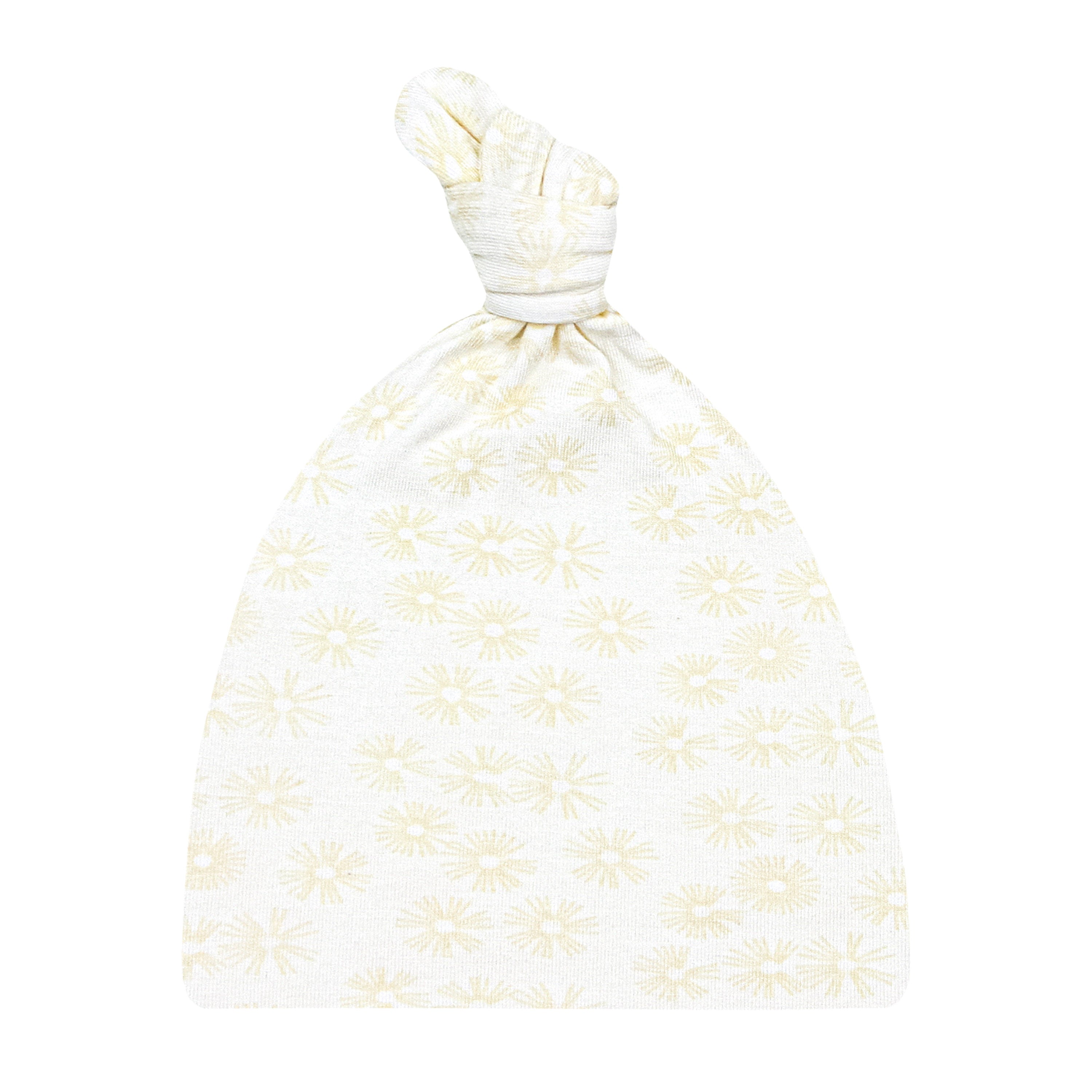 A beige top knot hat with a floral pattern